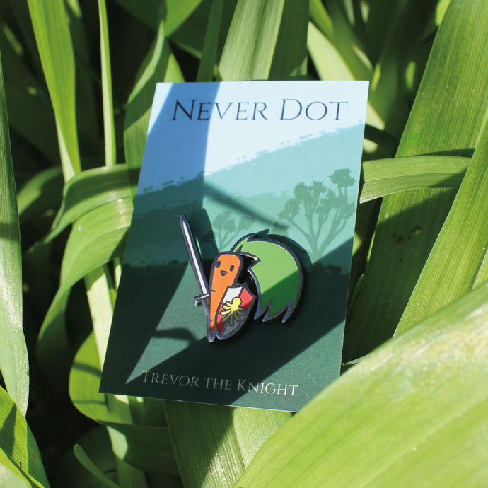 Carrot with sword enamel pin hiding among some leaves