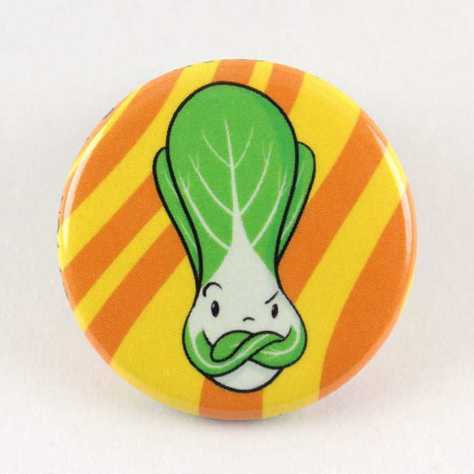 Button pin featuring an angry looking bok choy.  What did you do??