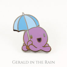 Product shot of an octopus with an umbrella hard enamel pin