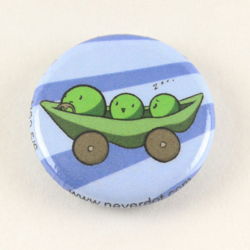 Magnet button with three peas in a pea pod equipped with wheels, steering, and limited brakes.  One of the peas is asleep, which doesn't bode well for their trip to Disney World later on